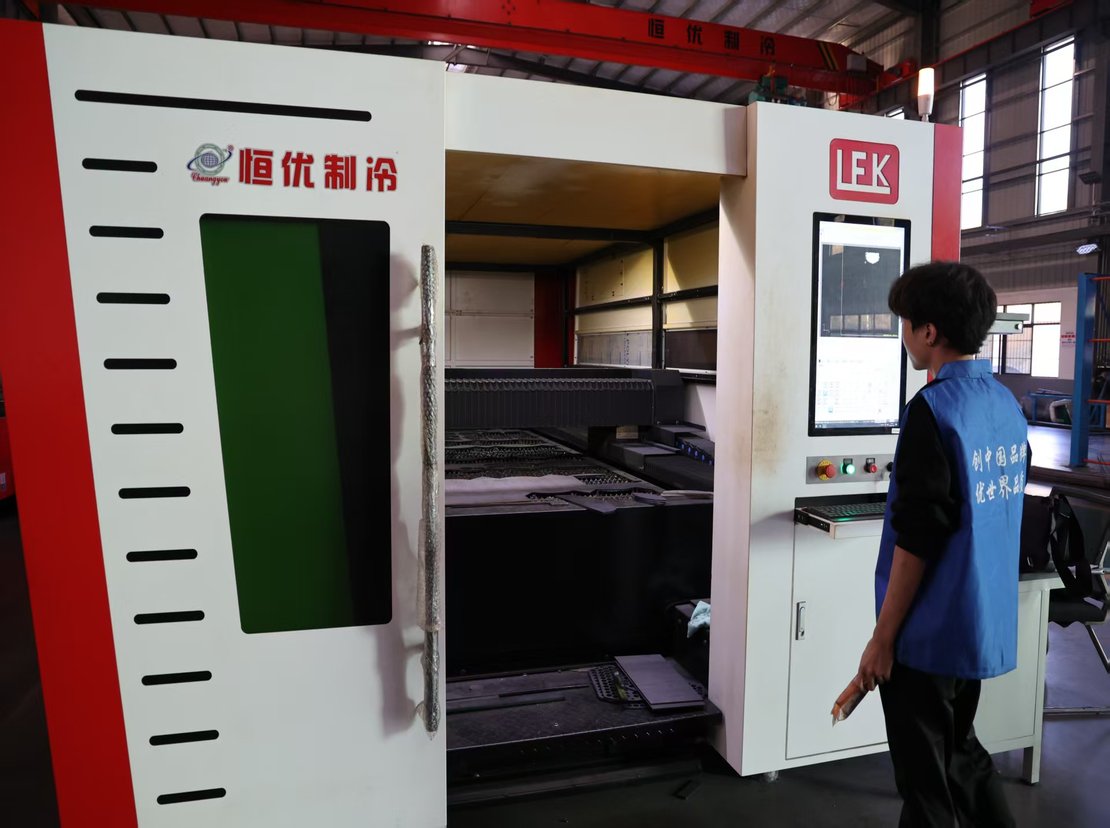 Laser cutting machine cutting tube sheets and baffles from steel plate