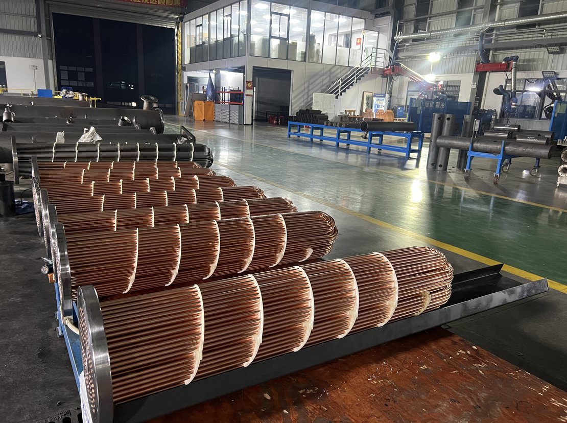 Completed copper tube bundles on the assembly rack